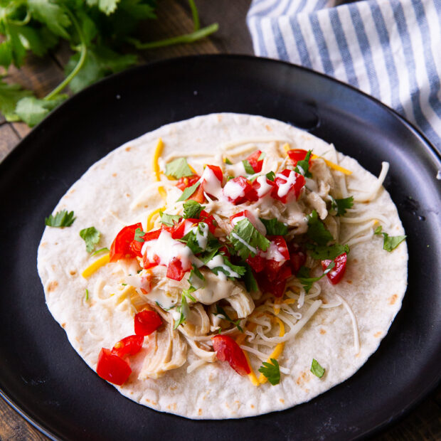A slow cooker salsa verde chicken, made into a taco