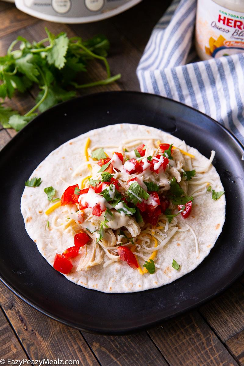 A slow cooker salsa verde chicken, made into a taco
