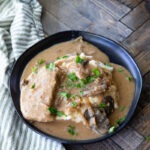 A plate of crockpot creamy mushroom pork chops