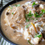 Creamy mushroom pork chops cooked in the slow cooker.