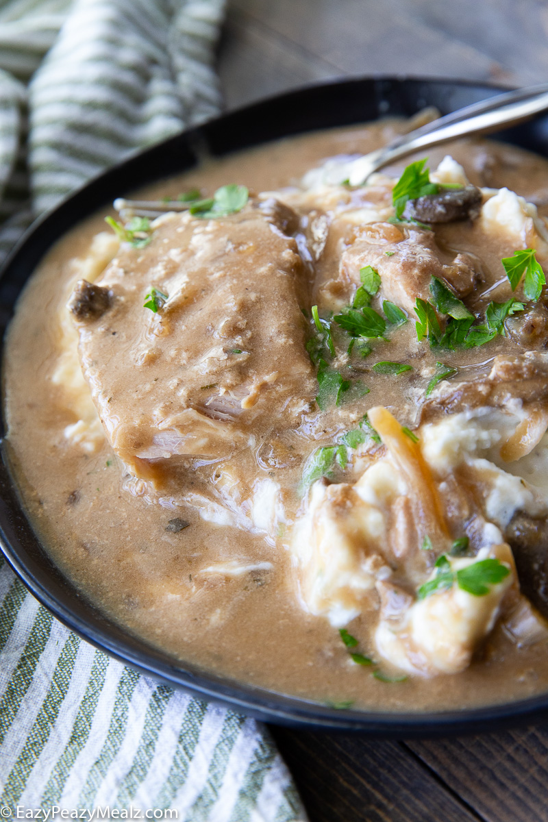 Creamy mushroom pork chops cooked in the slow cooker.