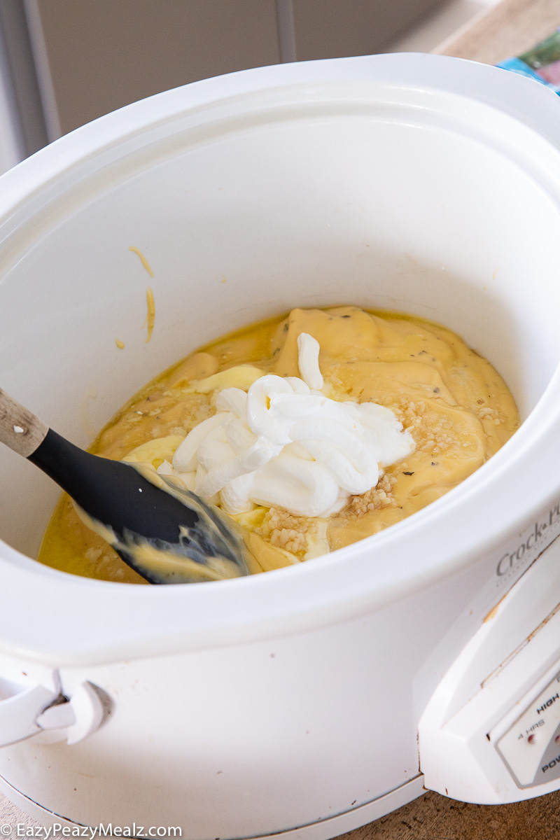 the sauce for a slow cooker of cheesy ham and potatoes