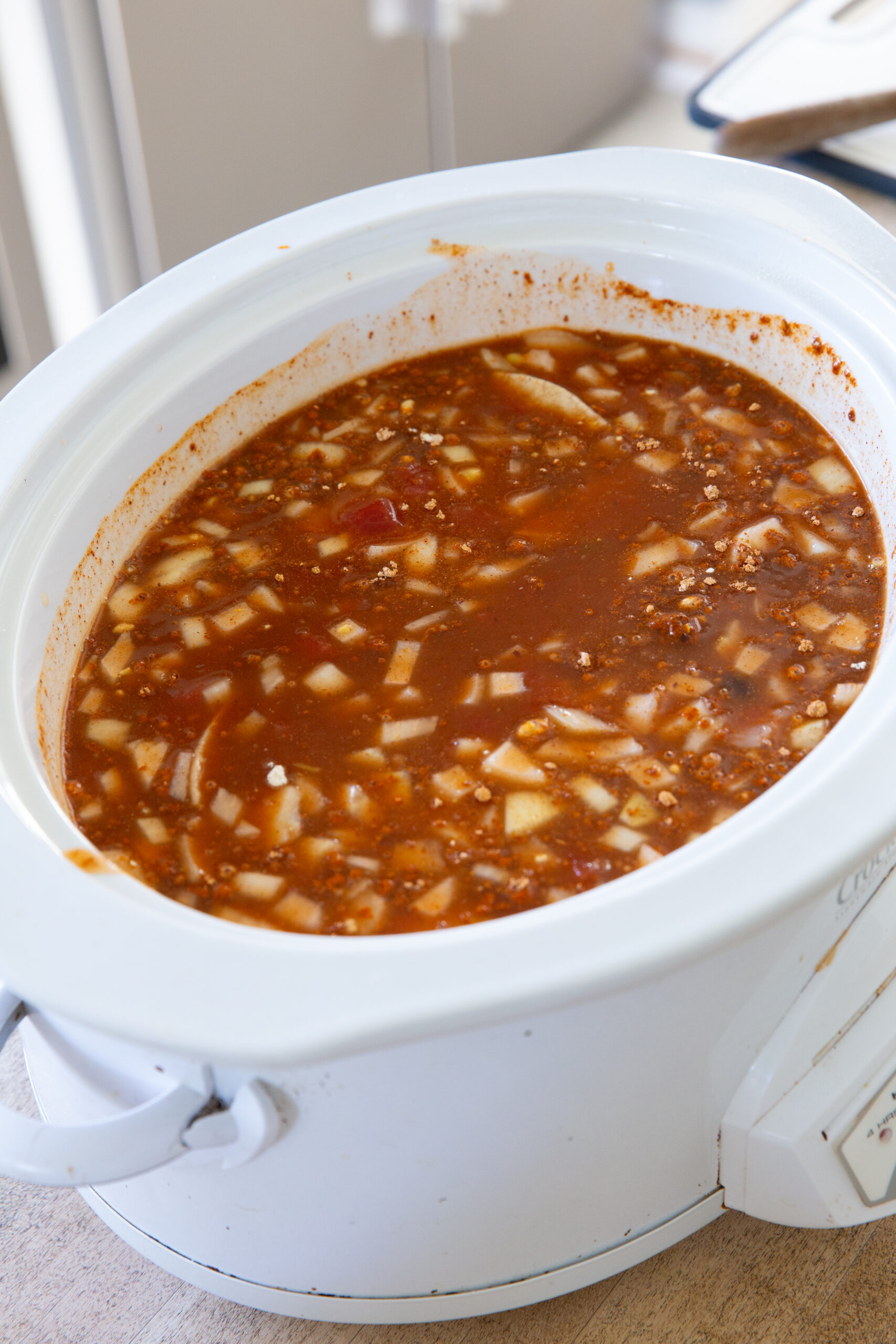 A crockpot full of chicken enchilada soup