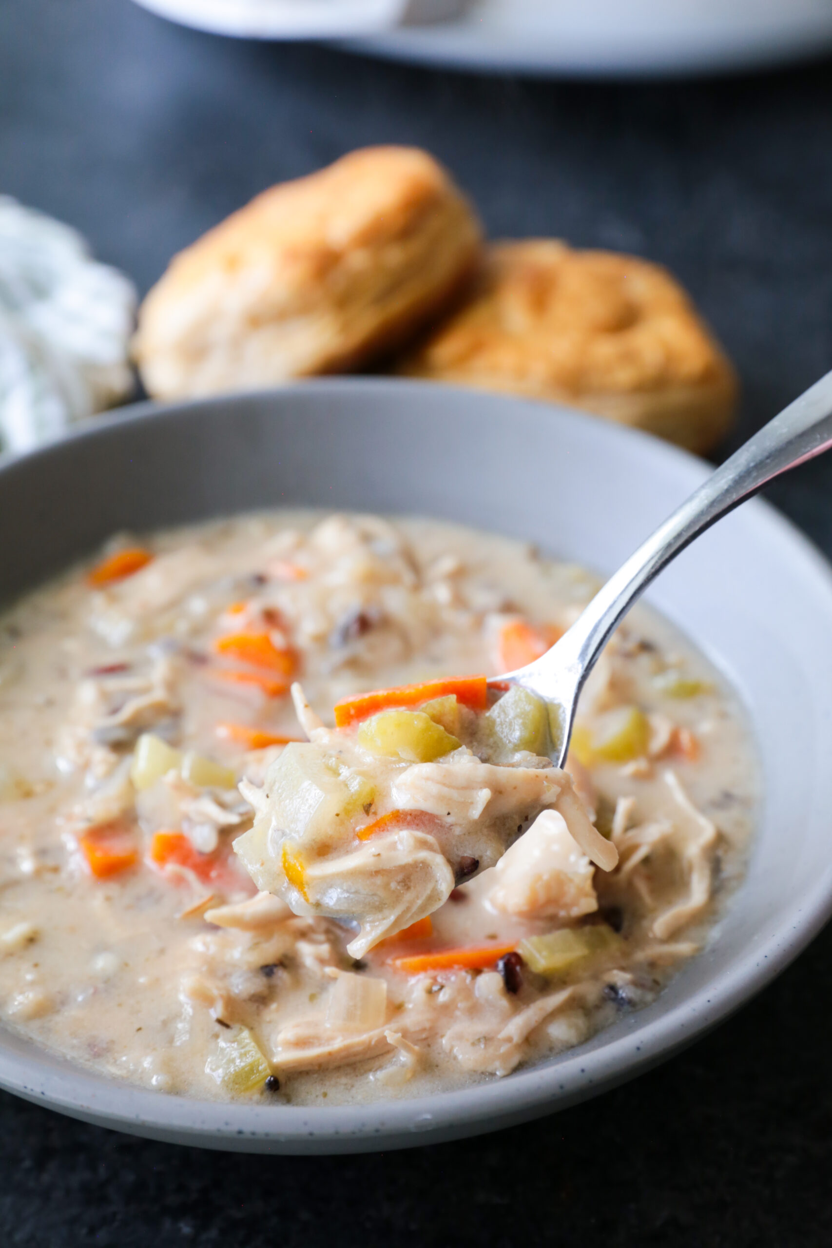 A bowl of cozy chicken and wild rice soup cooked in the crockpot