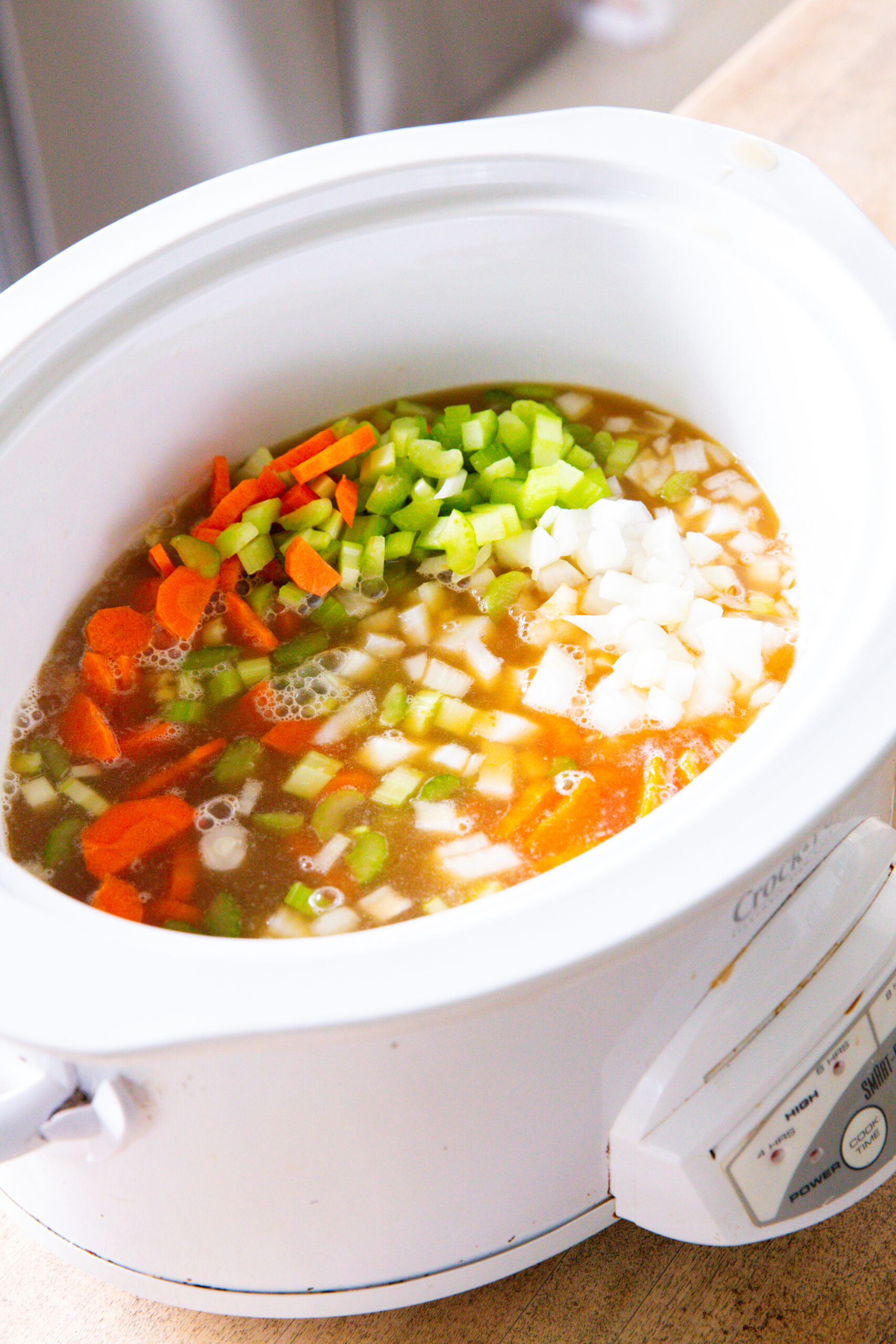 Steps for making chicken and wild rice soup in the slow cooker