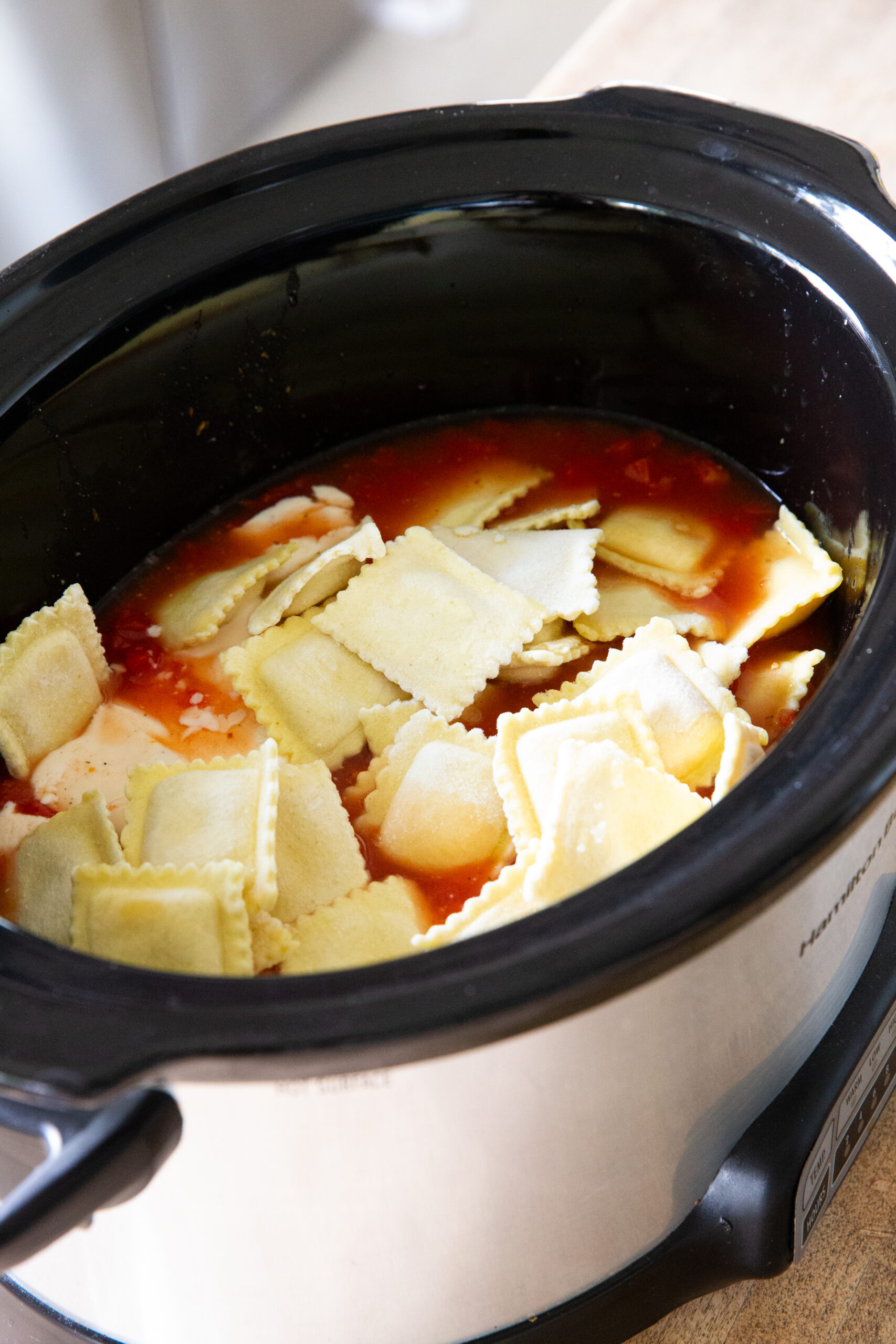 Add the ravioli and sausage to the pot