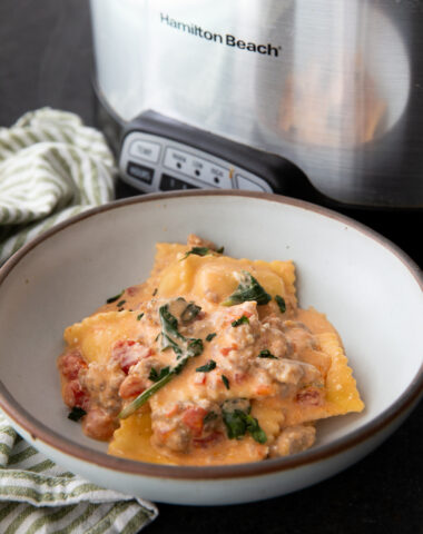 Crockpot creamy sausage ravioli in a bowl