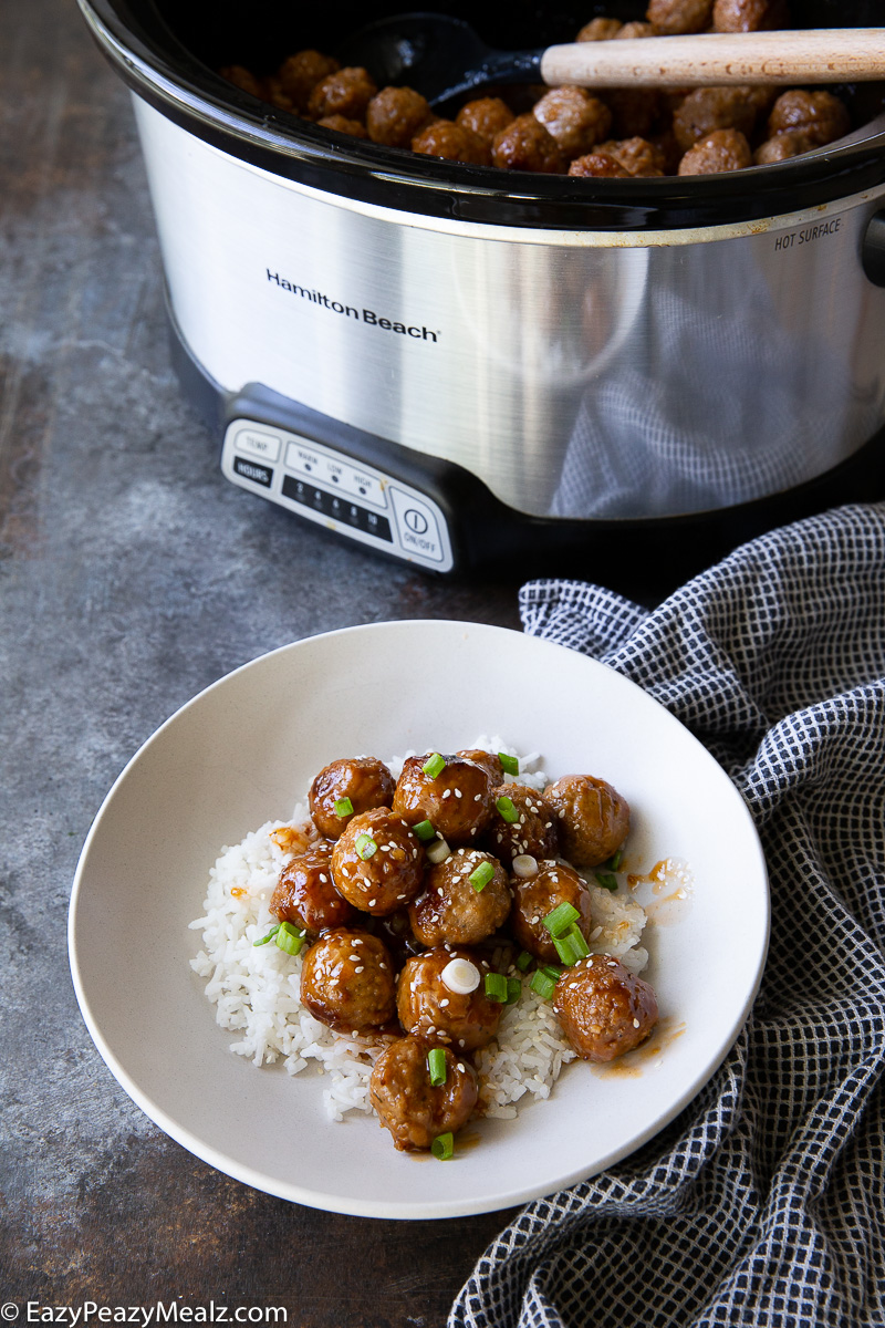 A slow cooker with honey garlic meatballs
