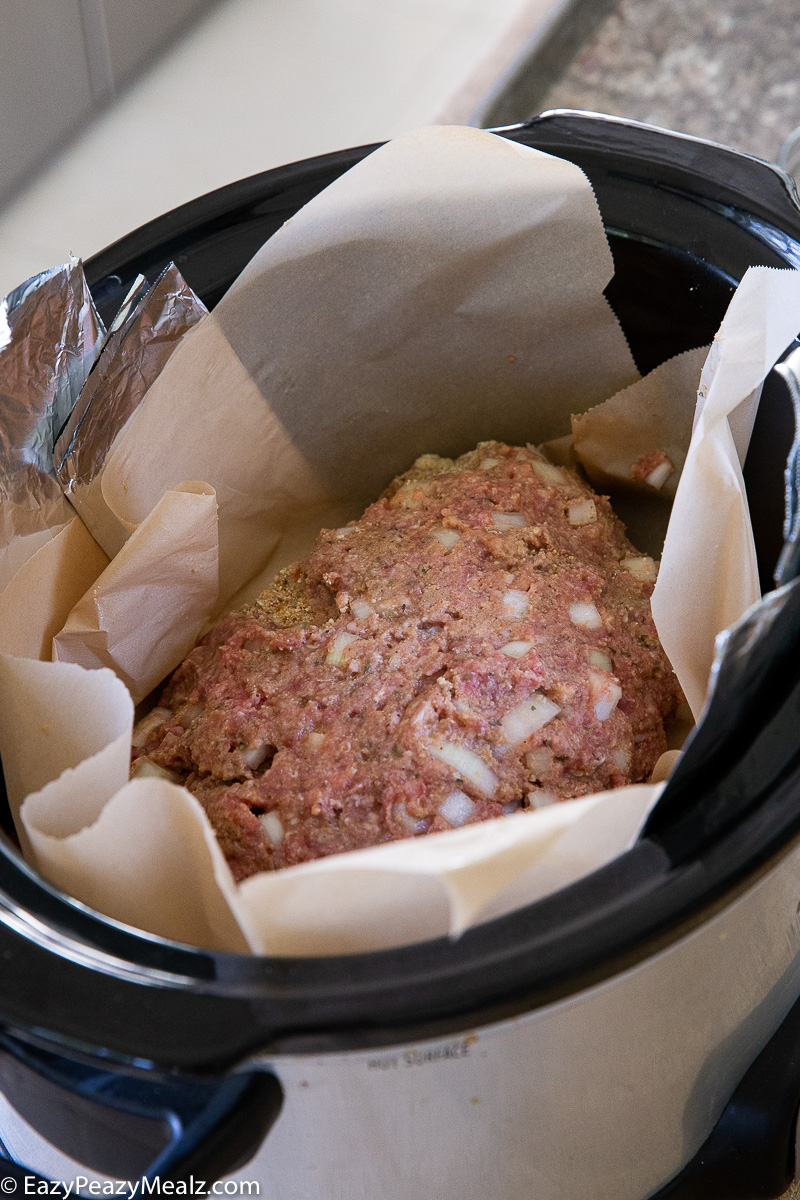 Making meatloaf in a slow cooker.