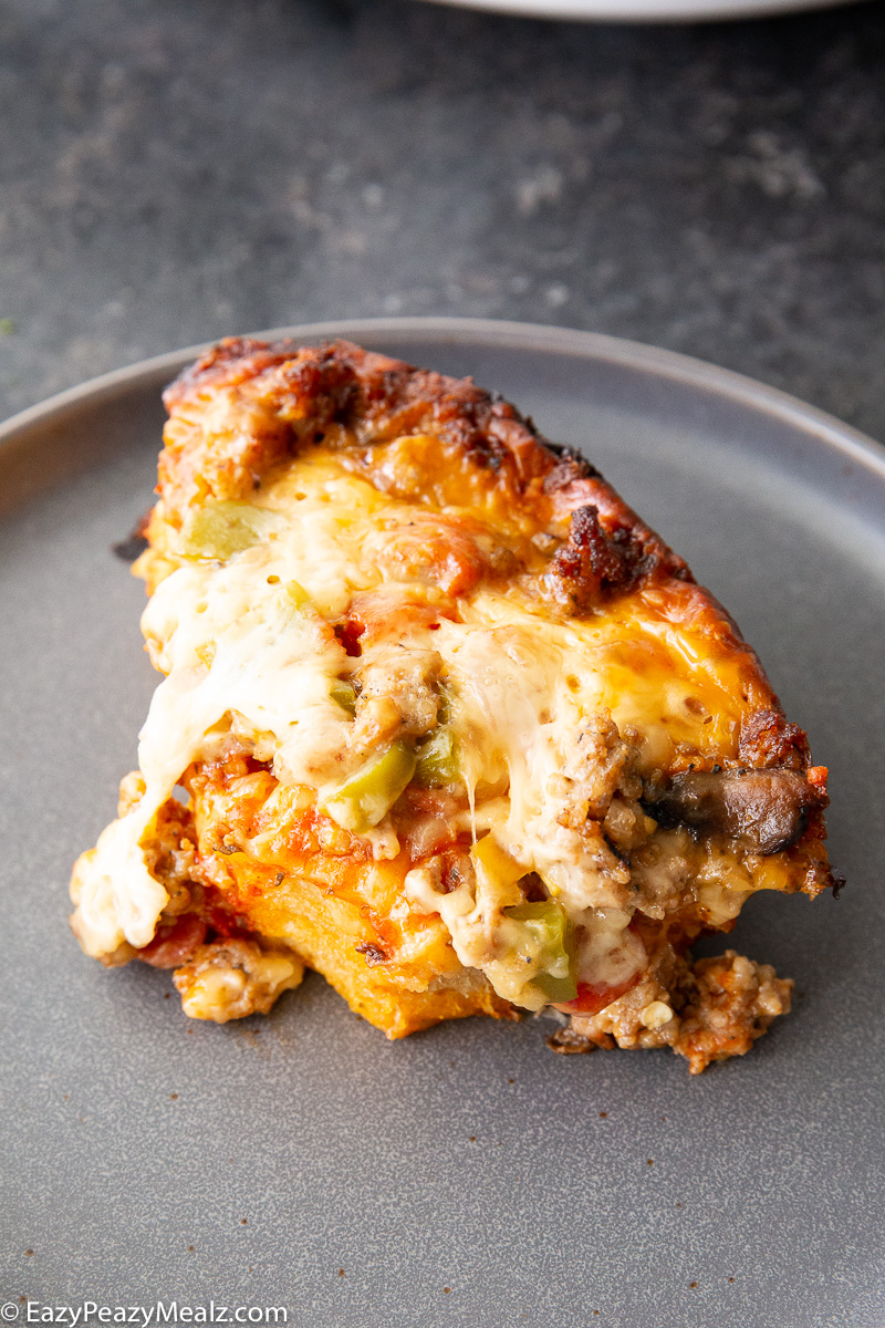 Pizza made in the slow cooker, a cross between pizza and casserole.